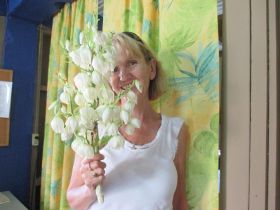 Woman in Belize holding Flor de Izote – Best Places In The World To Retire – International Living